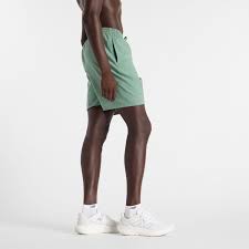 New Balance PANTALONI Verde